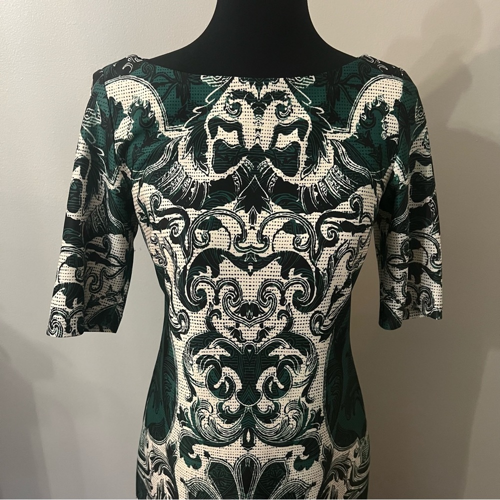 Size 8 Signature Camryn dress with elbow length sleeve.  Exposed back zip.
